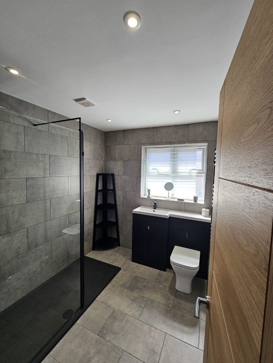 Post-construction clean of a newly fitted bathroom with walk-in shower